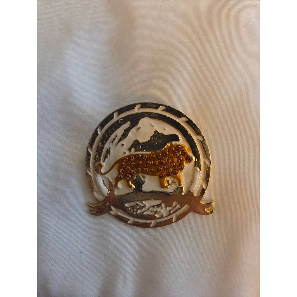 Vintage Gold Tone Lion Brooch with Amber Rhinestones and White Enamel Accent